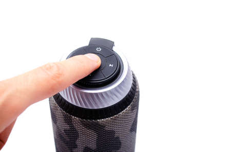 Wireless bluetooth color camouflage military column on a white background. The column stands...