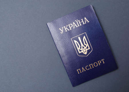 Ukrainian passport on a black background. The passport of the citizen of Ukraine in the macro....