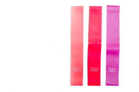 Elastic bands for fitness. Three elastic bands for fitness in close-up on a white background....