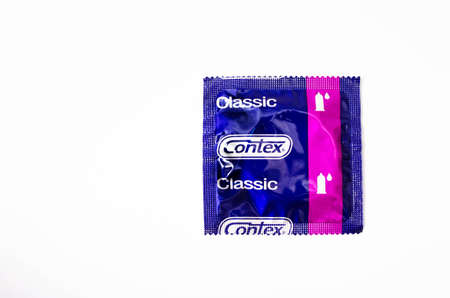 June 2020. Kiev, Ukraine. Contex classic condoms on a white background. One condom packaged in...