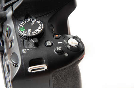 June 2020. Kramatorsk, Ukraine. Nikon D5100 SLR camera on a white background. Matrix, mirror on a camera in macro. Controls Nikon camera in macroのeditorial素材