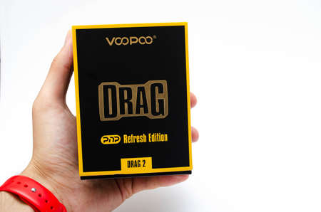 Box mod Drag 2 refresh edition with Pnp tank on a white background. Voopoo drag 2. Box mod packing, black-red in macro and in hands. July 2020. Los Angeles, USAのeditorial素材