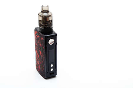 Box mod Drag 2 refresh edition with Pnp tank on a white background. Voopoo drag 2. Box mod packing, black-red in macro and in hands. July 2020. Los Angeles, USAのeditorial素材