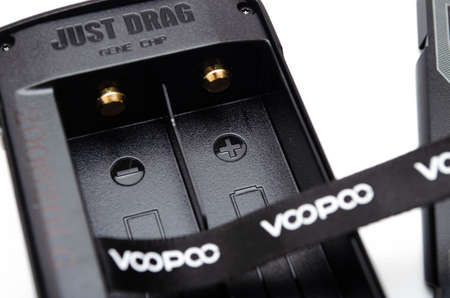 Box mod Drag 2 refresh edition with Pnp tank on a white background. Voopoo drag 2. Box mod packing, black-red in macro and in hands. July 2020. Los Angeles, USAのeditorial素材