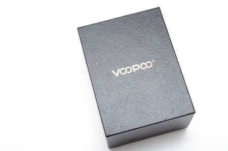 Box mod Drag 2 refresh edition with Pnp tank on a white background. Voopoo drag 2. Box mod packing, black-red in macro and in hands. July 2020. Los Angeles, USAのeditorial素材