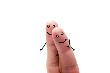 Two fingers on a white background with and without a face. Various emotions, joy, sadness, anger are depicted on the fingersの写真素材