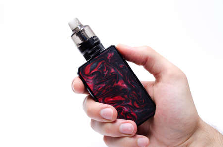 Voopoo drag 2 with Pnp Tank and tank with coils. Hot, red vape coils. Refueling steam in close-up on white background. July 2020. Los Angeles. USAのeditorial素材