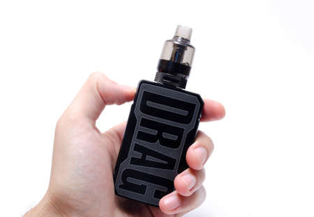 Voopoo drag 2 with Pnp Tank and tank with coils. Hot, red vape coils. Refueling steam in close-up on white background. July 2020. Los Angeles. USAのeditorial素材