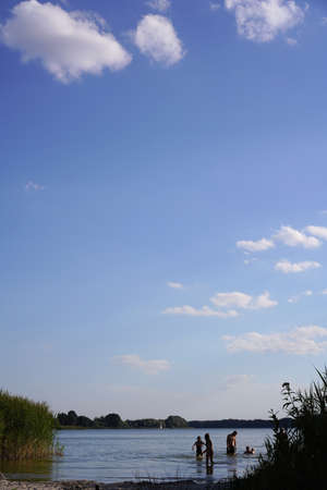 Rybojedzko, Poland - July 29, 2020: people on the beach and lakeのeditorial素材