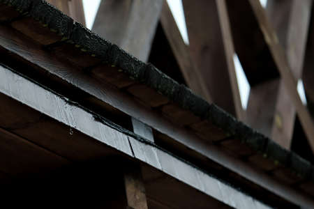 Wooden, wet balcony during rainの写真素材