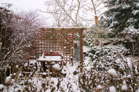 Garden with a gazebo in the winterの写真素材