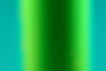 A Green Blurred Image of a Cylinder Showing the Graduated Colours Forming a Shapeの写真素材