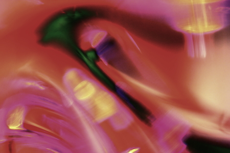 A Blurred Macro Image of Colored Glass Artifacts Showing Pastel colours of Graduated Light Forming a Fantasy Styled Imageの写真素材