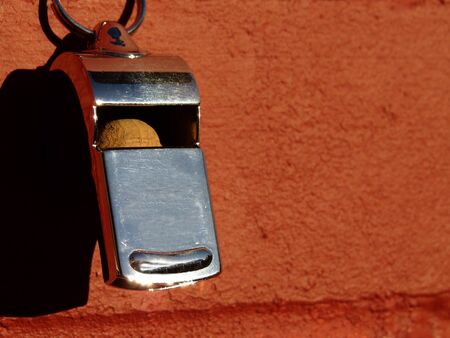 A Shiny Whistle on a Red Brick Wallの写真素材