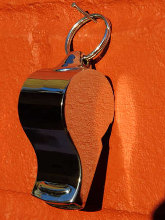 A Shiny Whistle on a Red Brick Wallの写真素材