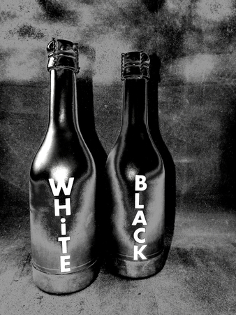 Two Plastic Black and White Bottles with the Words Black and White 3dの写真素材