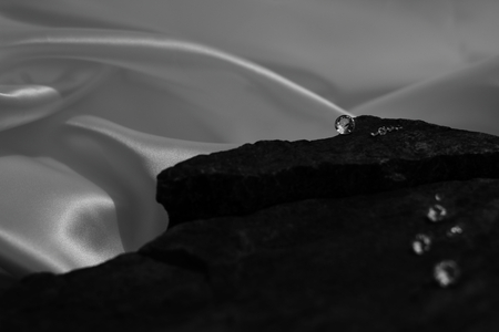 In and Out of Focus Scattered Diamonds Showing the Facet Cut of the Gemの写真素材