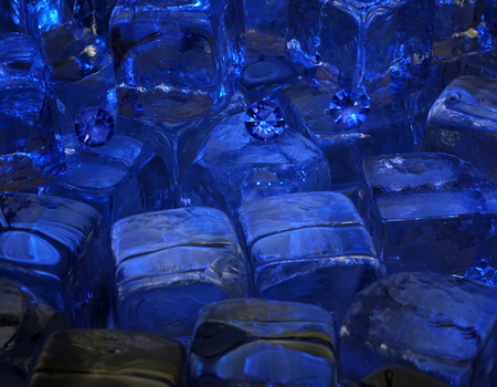 Scattered Diamonds on Ice Cubes, Showing the Facet Cut of the Gem Stone.の写真素材