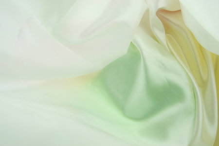 A Imitated Silk Sheet, Showing Close Detail to the Satin Perforated Green Yellow and White Colours.の写真素材
