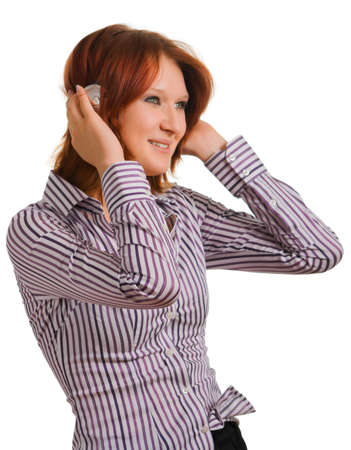 young girl enjoying the music, which makes her happyの写真素材