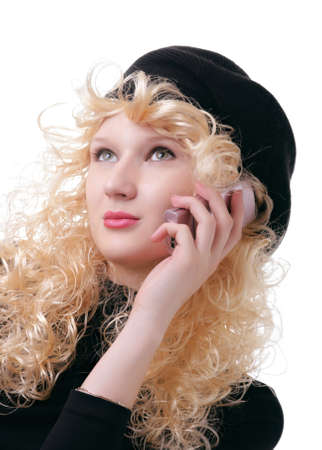 pretty blonde is talking on a cellular phoneの写真素材