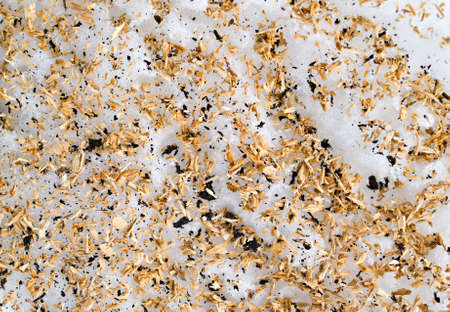 background with the snow and the wooden sawdust on itの写真素材