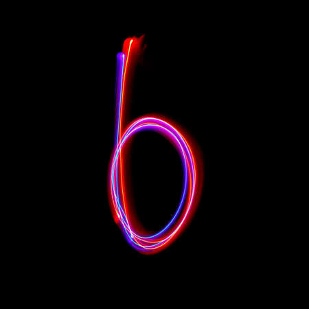 Letters of English alphabet on black background. Freezelight photo.の写真素材