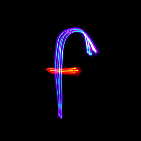 Letters of English alphabet on black background. Freezelight photo.の写真素材