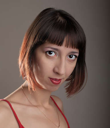 Beautiful girl in the studio. Very artistic portrait. The girl looks natural.の写真素材