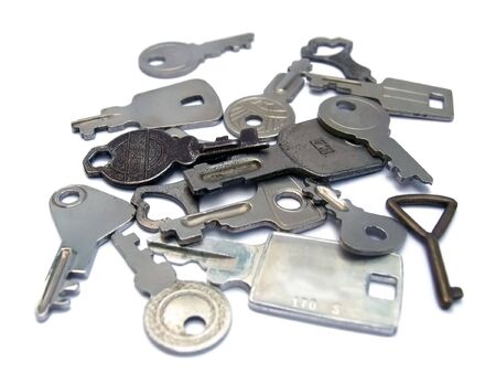  bunch of old small  keys on white background