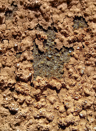 Fragment of old wall with destroyed stucco         
