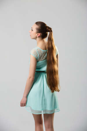 Portrait of beautiful woman with perfect long shiny healthy hair studio shotの写真素材