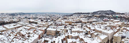 Roofs of Lviv, Ukraine - January 26, 2012. Wine panorama over Lvov city on snpowy winter day. Old historical downtown arhitecture.のeditorial素材