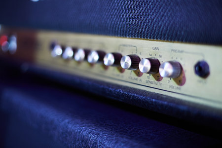 Guitar amplifier, level knobs closeup shot. Electric guitar amp closeup photo for rock music.の写真素材