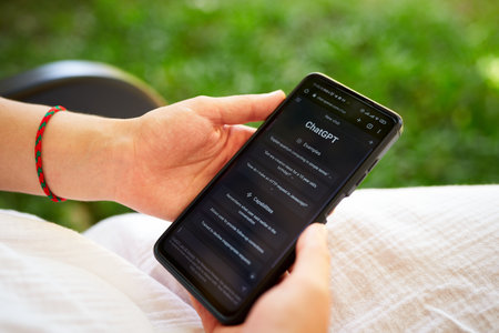 February 5, 2023, Mirissa, Sri Lanka. Using OpenAI chatGPT on phone. Woman chats with artificial intelligence. Person tests neural network language Mirissa online. Human talks to AI via GPT close-upのeditorial素材