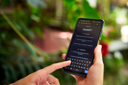 February 5, 2023, Mirissa, Sri Lanka. Using OpenAI chatGPT on phone. Woman chats with artificial intelligence. Person tests neural network language Mirissa online. Human talks to AI via GPT close-upのeditorial素材