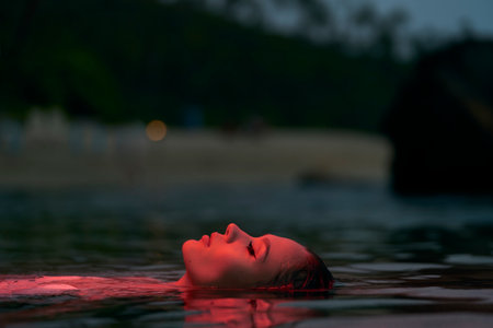 Woman enjoys serene swim in lagoon at dusk, peaceful floating, relaxation concept, tranquil water...