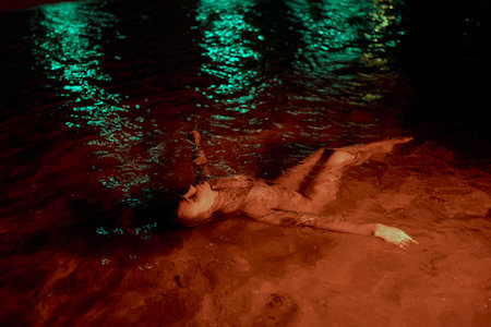 Elegant woman lounges in a water lagoon at night, embodying tranquility in liquid embrace....