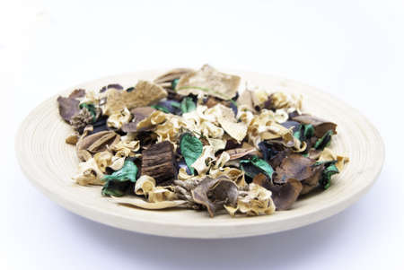 wood plate with dry plantsの写真素材