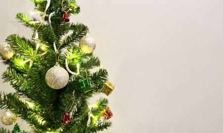 Decorated Christmas tree  with colorful gift box and bell  isolated on white background