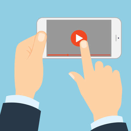 Smartphone with play button. Hands holding phone and touching play button. Concept of video, audio, internet and games.のイラスト素材
