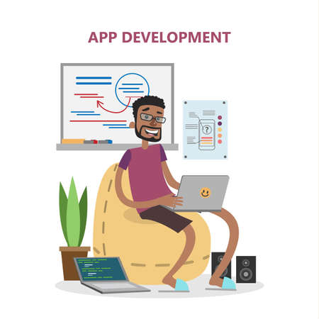 Male app developer. Smiling african man wiith laptop developing applications.