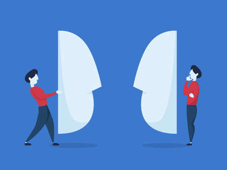 Business people stand behind the giant mask