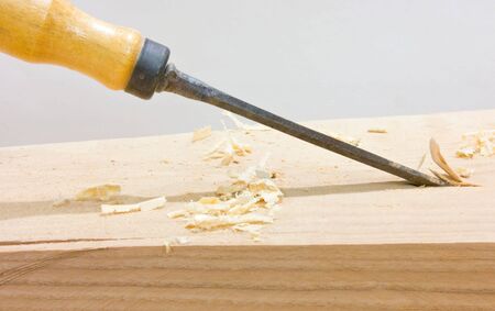 Chisel, sawdust and wood plaqueの写真素材