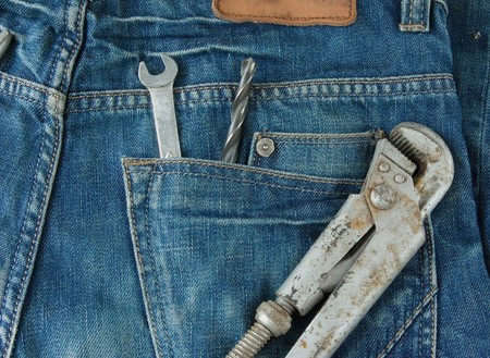 work tools in jeans back pocket. Work wear themeの写真素材
