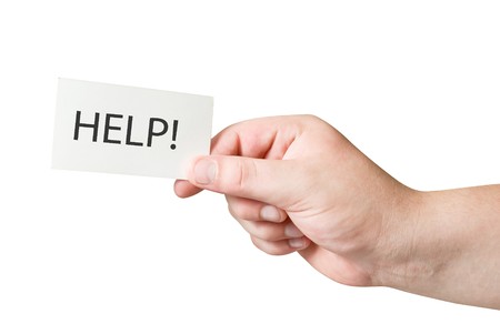 white paper card with Help text in human hand isolated