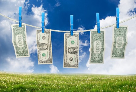 One Dollar Hanging a Rope with Clothespins on landscpae background