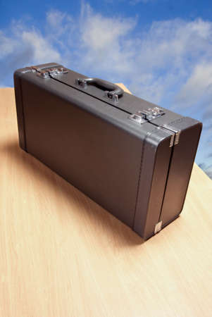 suitcase, table and sky background