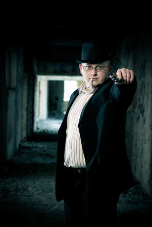 stylish young man with gunの写真素材