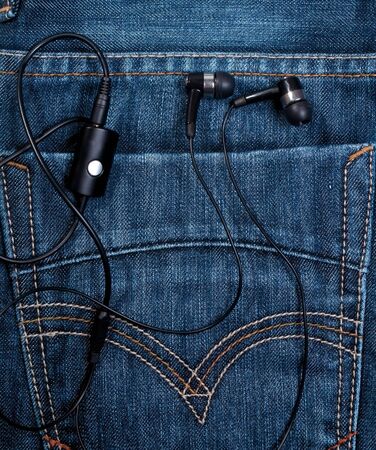 headset in back pocket blue jeansの写真素材